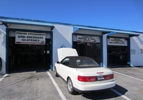 Sammy Auto House auto repair shop exterior with a white car parked outside | Sammy’s Auto House